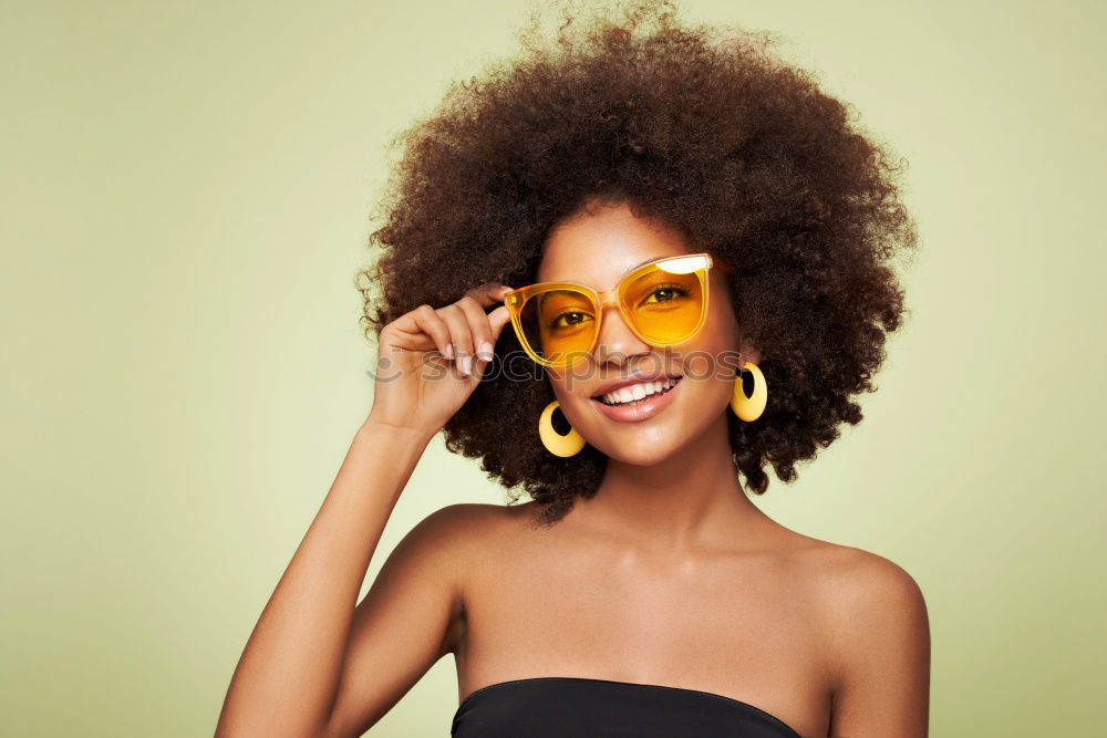 Similar – Image, Stock Photo Young beautiful Afro-American woman posing and smiling while standing against brick wall