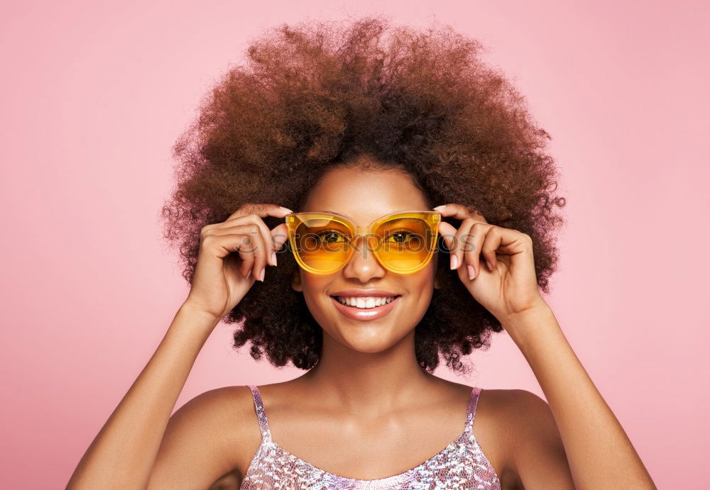 Similar – Image, Stock Photo Young beautiful Afro-American woman posing and smiling while standing against brick wall