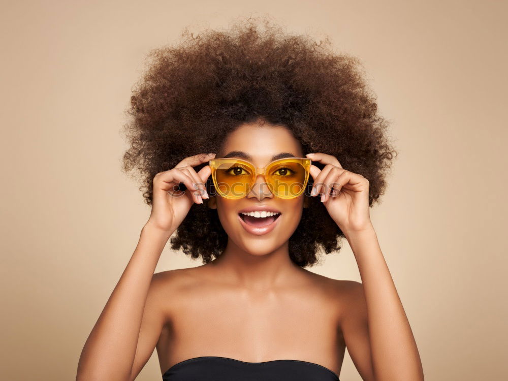 Image, Stock Photo Young beautiful Afro-American woman posing and smiling while standing against brick wall