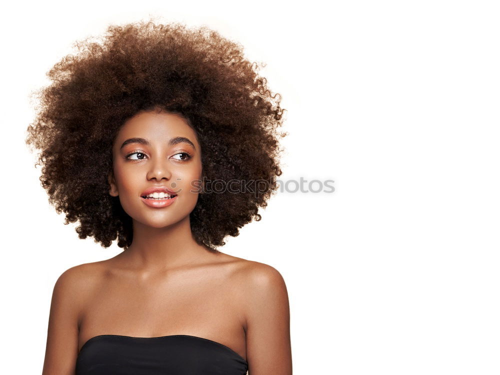 Similar – Image, Stock Photo Young beautiful Afro-American woman posing and smiling while standing against brick wall