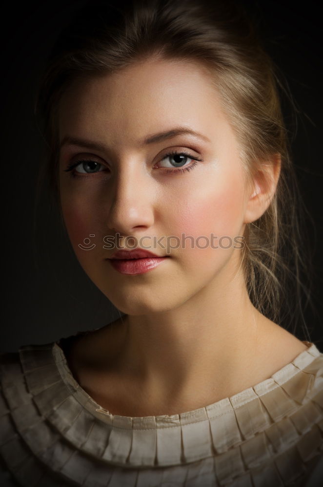 Similar – Portrait of a young teenager girl standing looking throughout the window