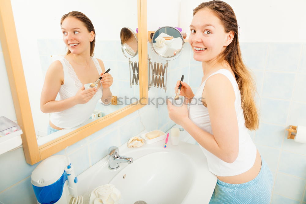 Similar – Young female adult brushing teeth in the morning