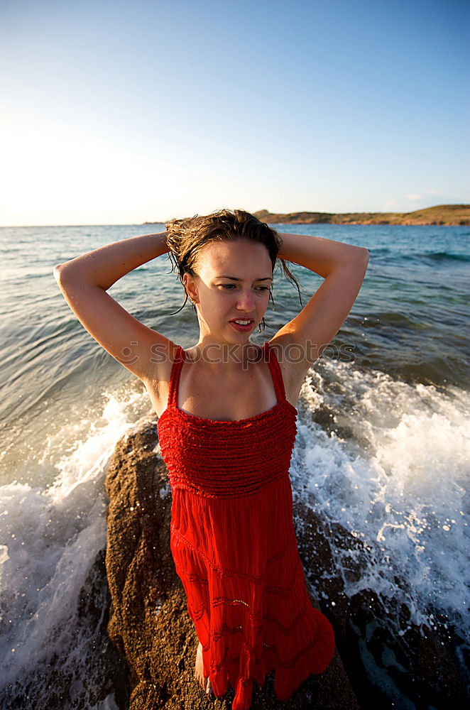 Similar – Image, Stock Photo Woman standing in the sea splashing with water in the evening light