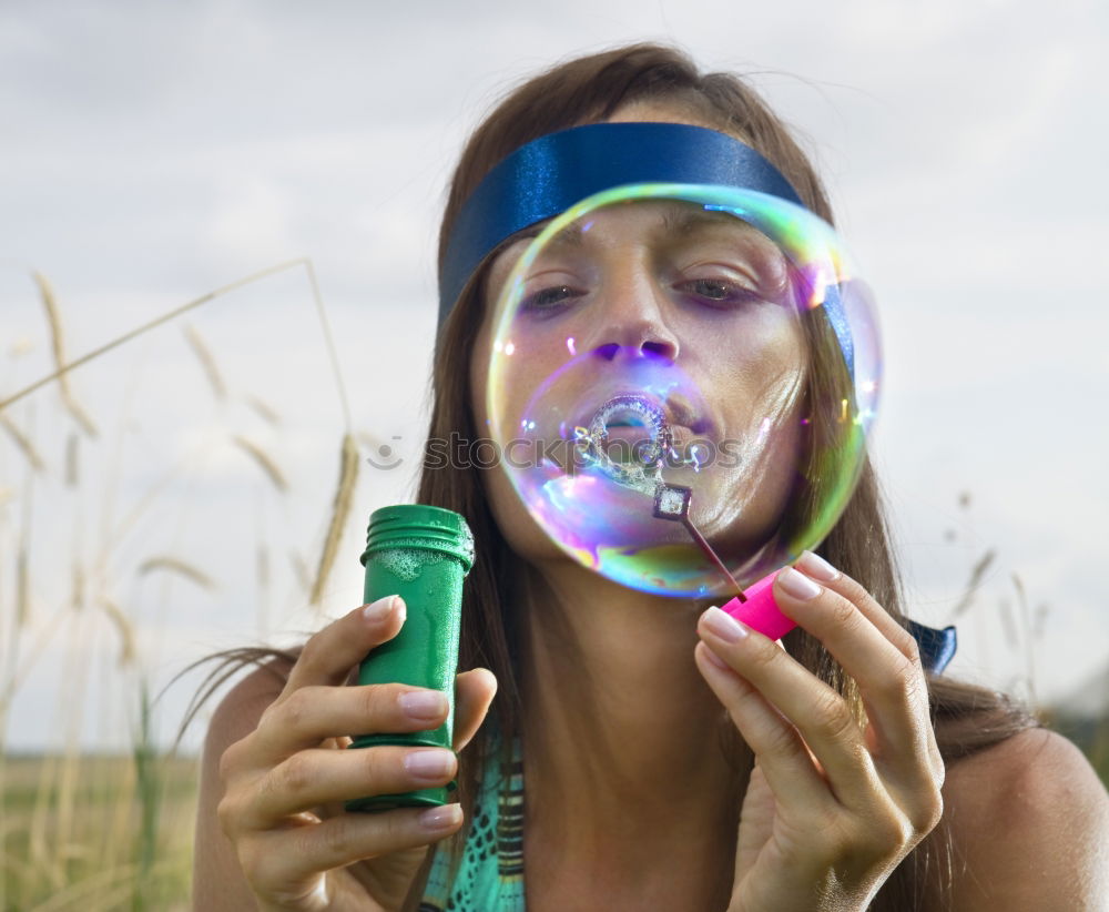 Similar – Image, Stock Photo Young caucasian women blowing bubbles