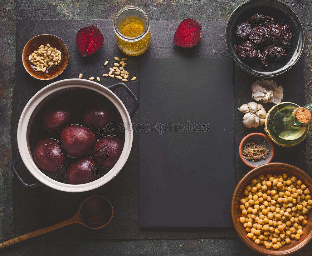 Similar – Image, Stock Photo Healthy homemade beetroot salad with chickpeas and pine nuts in glasses for lunch on dark kitchen table background with ingredients, top view. Purple vegetables eating. Clean dieting food.