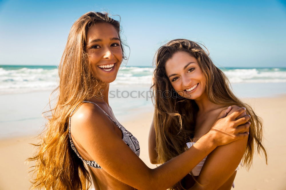 Similar – Tender lesbian couple kissing at sunset