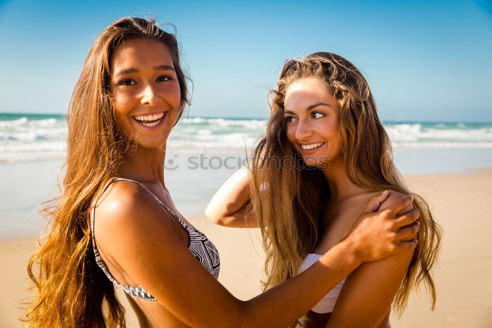 Similar – Tender lesbian couple kissing at sunset