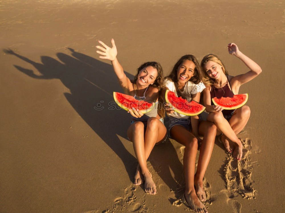 Similar – Image, Stock Photo Woman eating watermelon at the beach in sunset