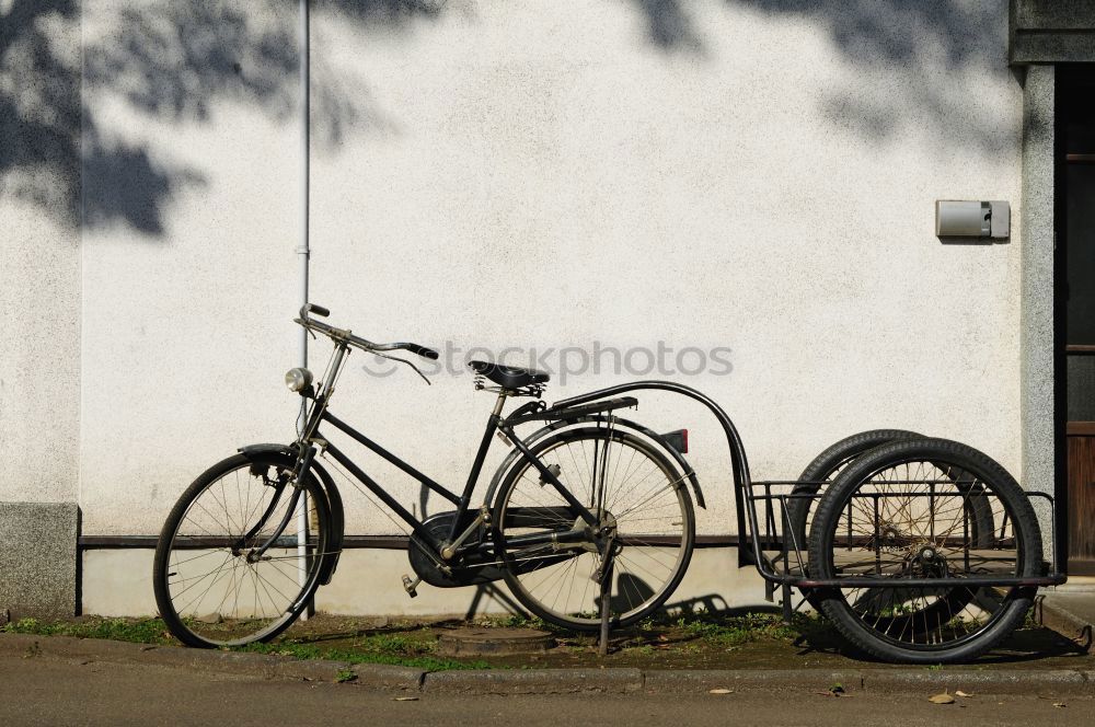 Similar – Image, Stock Photo Classic Holland bike in beige with saddle cover in front of a matching house wall in Cologne on the Rhine in North Rhine-Westphalia