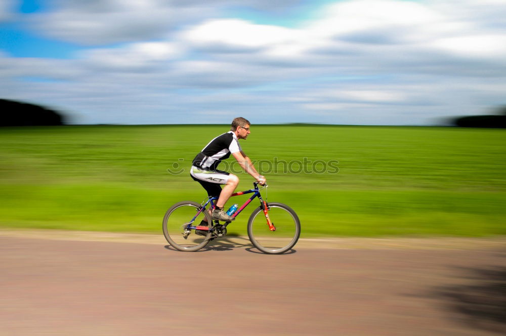 Similar – Cyclists on the road Green