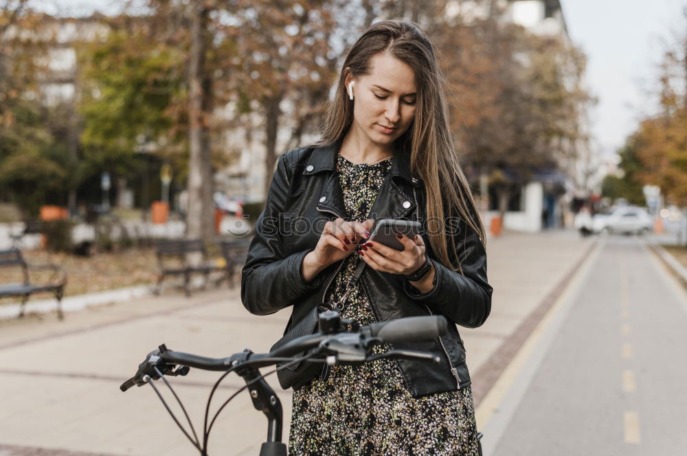 Similar – Image, Stock Photo Women with bikes browsing smartphone