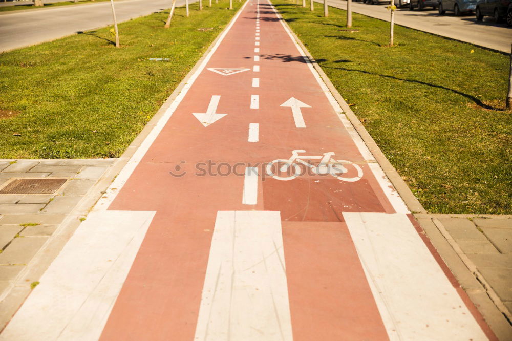 Similar – Signs I In front of a yellow house on the left and right side of the road there are traffic signs