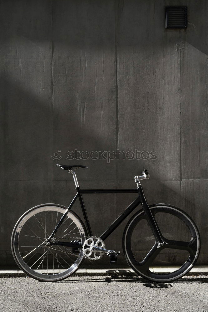 Similar – Young man is holding blue bike in urban street