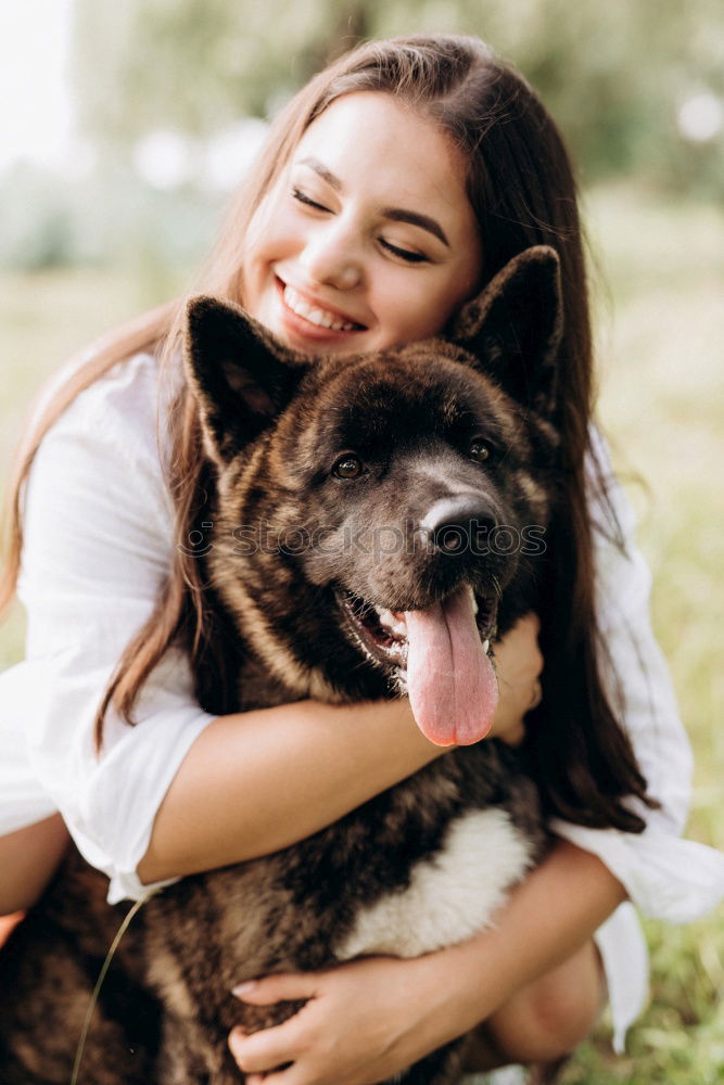 Similar – A pretty girl hugs her pet while kissing her