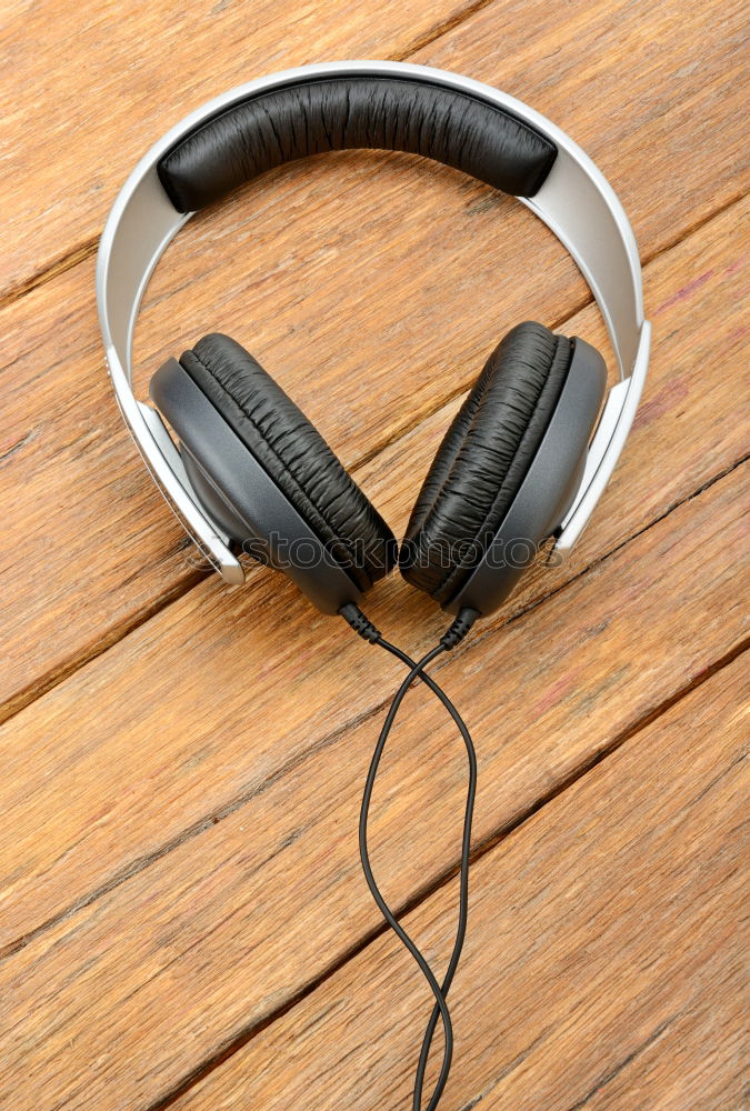 Similar – Image, Stock Photo White smartphone with headphones on the old wooden board