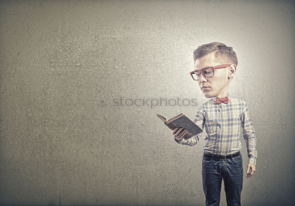 Image, Stock Photo One little boy reading to robot from cardboard boxes outdoors. Concept of science and education.