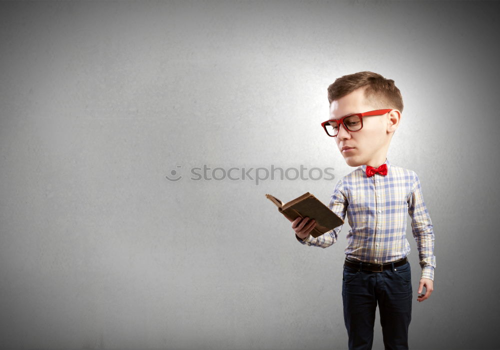 Similar – Image, Stock Photo One little boy reading to robot from cardboard boxes outdoors. Concept of science and education.