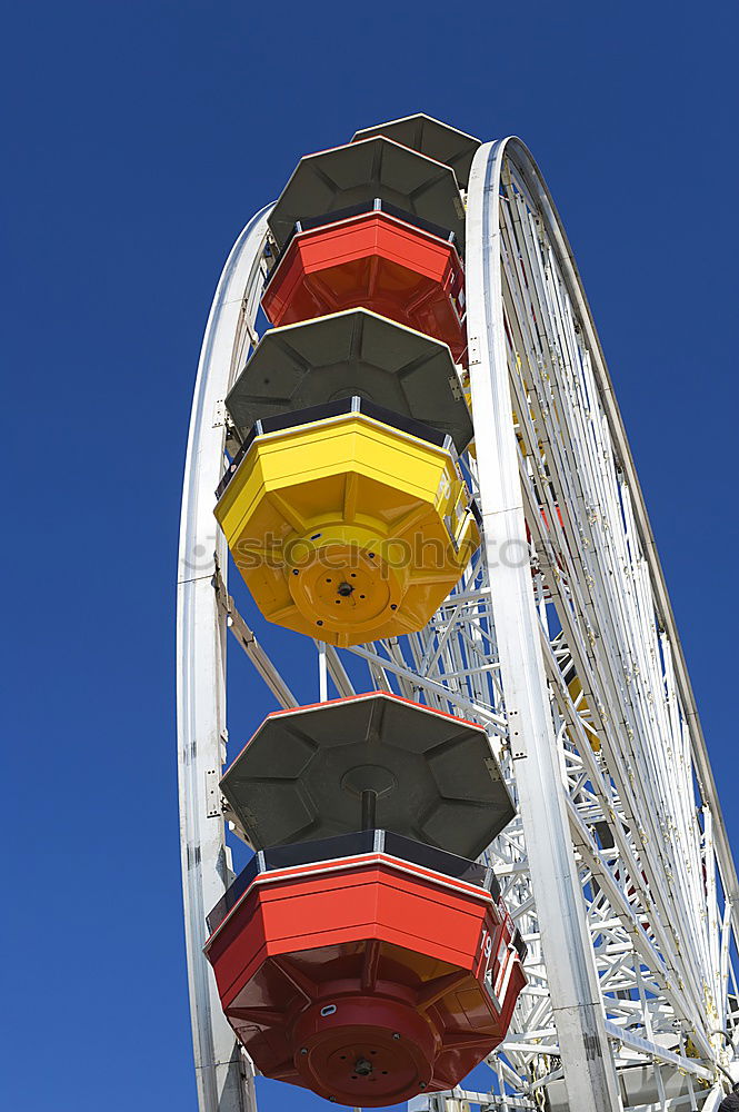 Similar – Twirly swing ride Blue sky