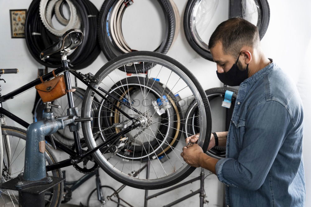 Similar – Man working on bike