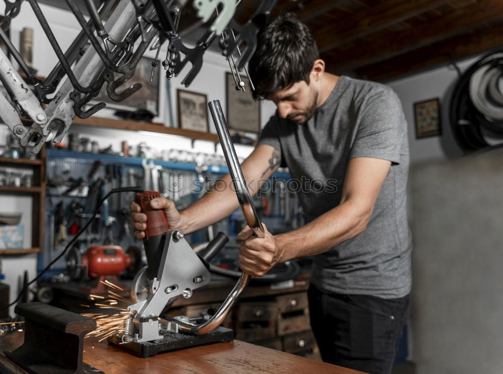 Similar – Image, Stock Photo Mechanic cleaning a motorcycle