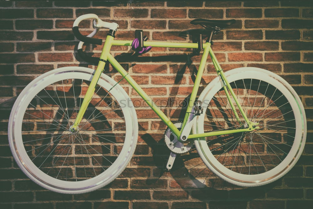 Similar – Young man is holding blue bike in urban street