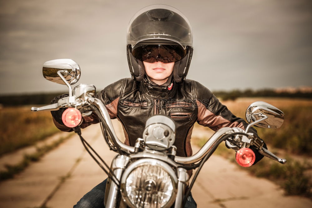 Similar – Woman on a motorcycle