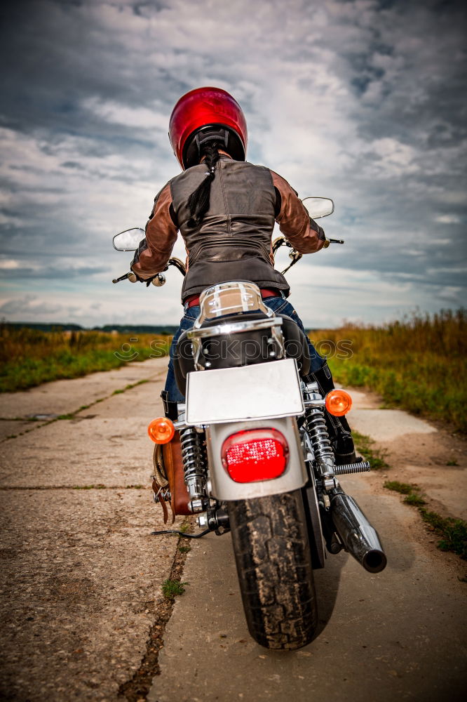 Similar – Man riding custom motorbike