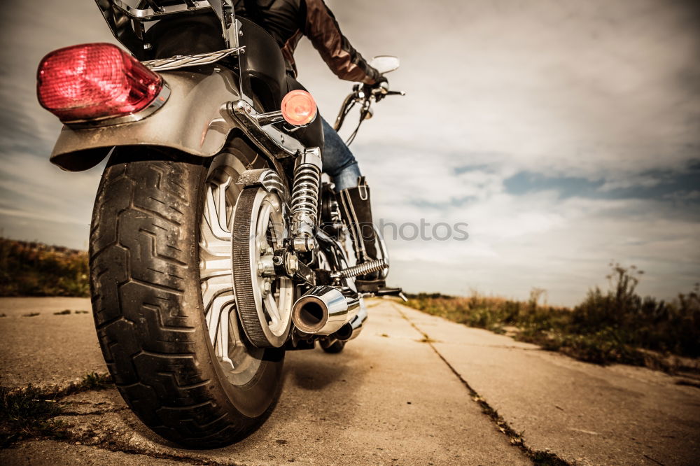 Similar – Man on bike looking away