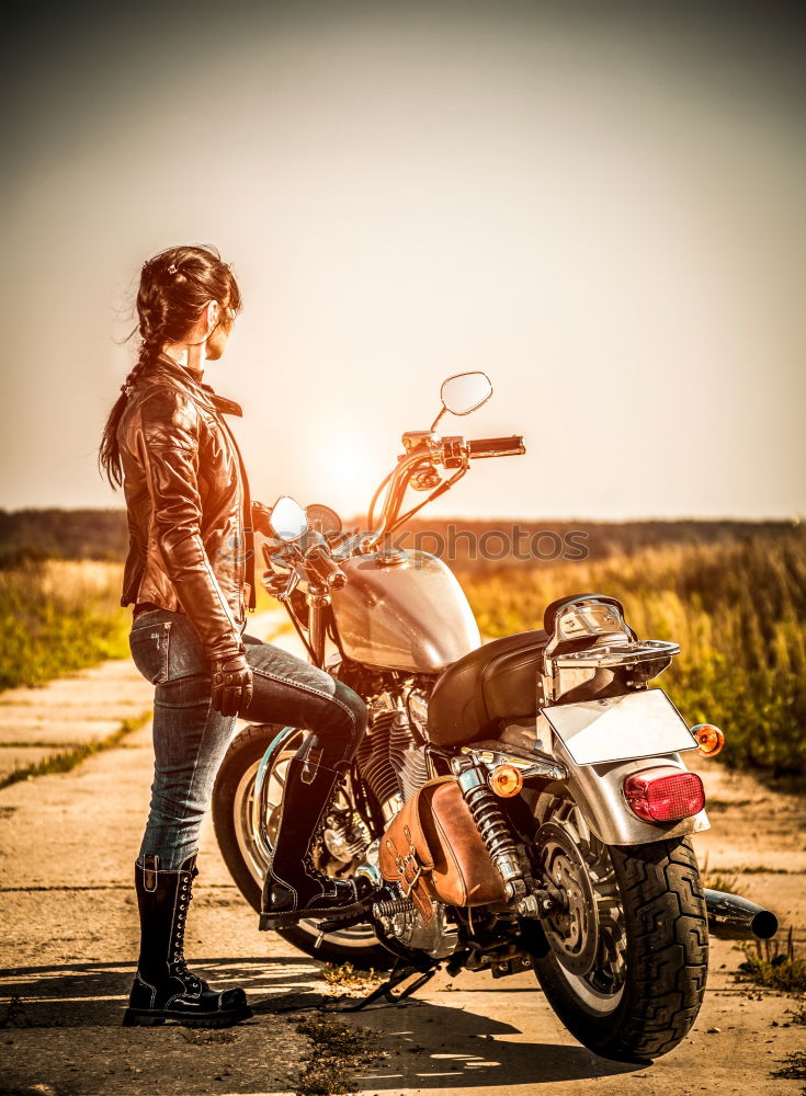 Similar – Man standing near motorcycle