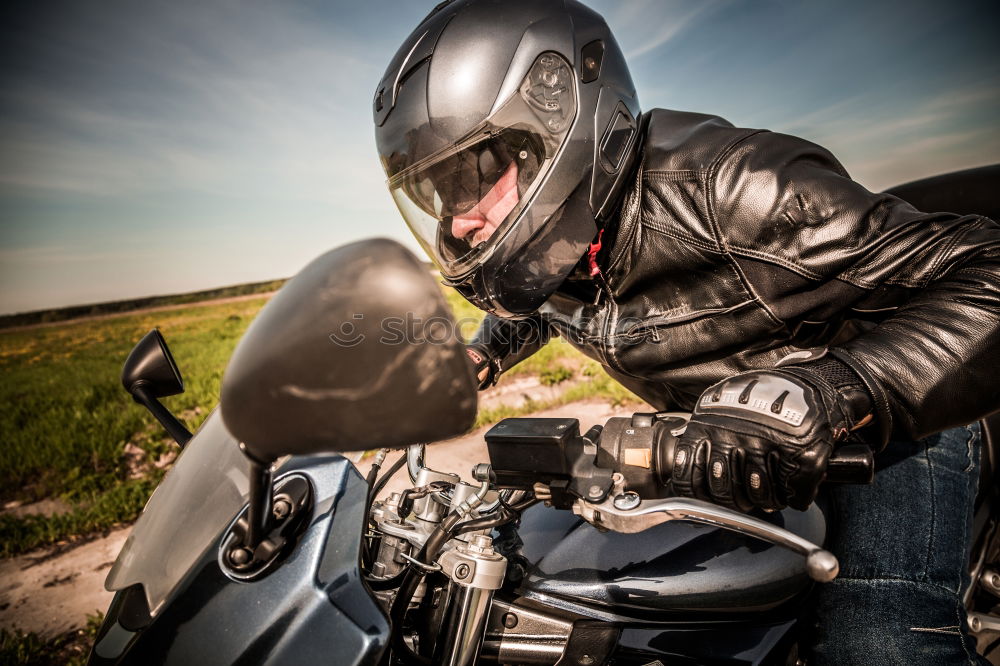 Similar – Image, Stock Photo Man sitting near motorcycle