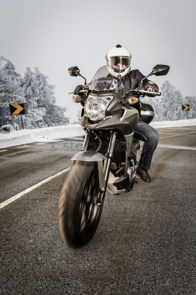 Similar – Man on bike looking away