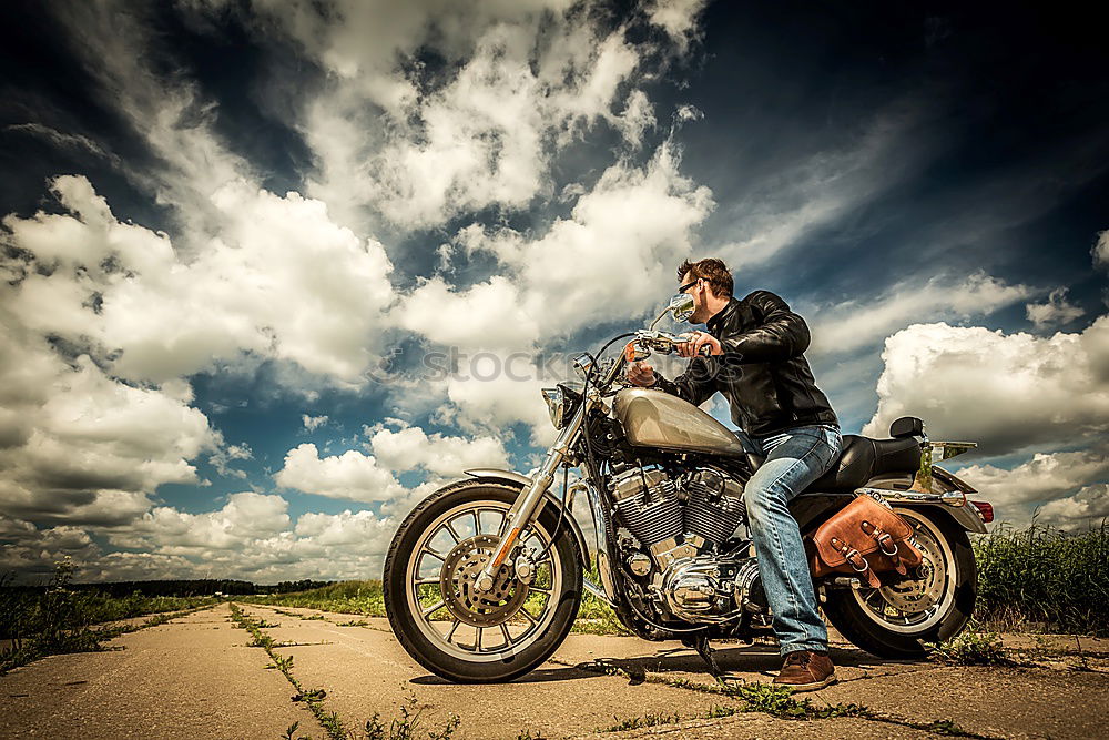 Similar – Man standing near motorcycle