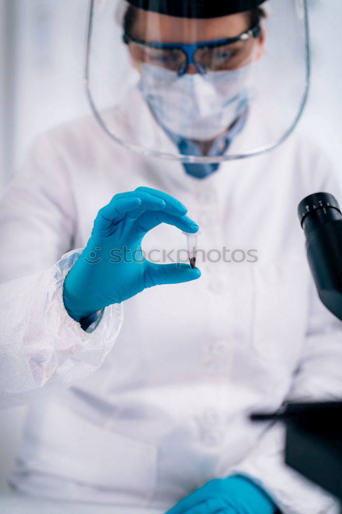 Similar – Image, Stock Photo Hands holding plastic test tube