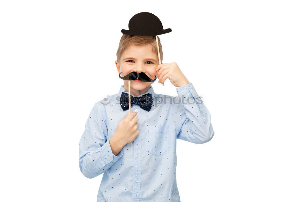 Funny boy with fake mustache and tie