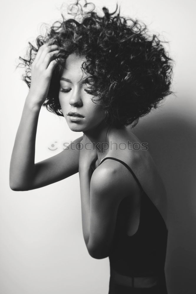 Similar – Beautiful serious thoughtful and sad black woman covering her head with sheet in bed