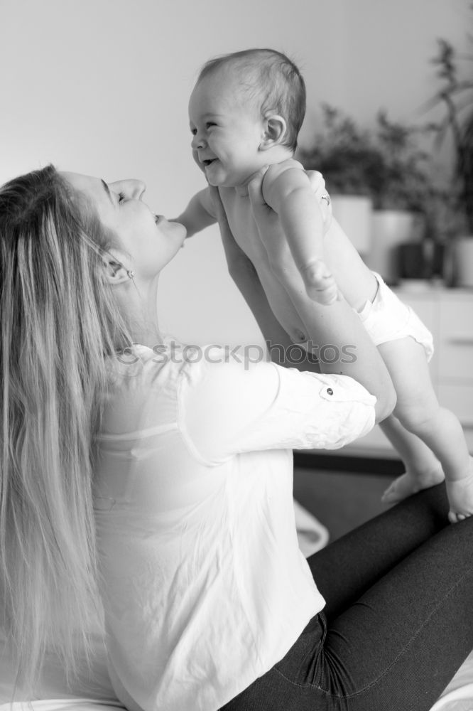 Similar – Image, Stock Photo Mother and Son cuddling at home