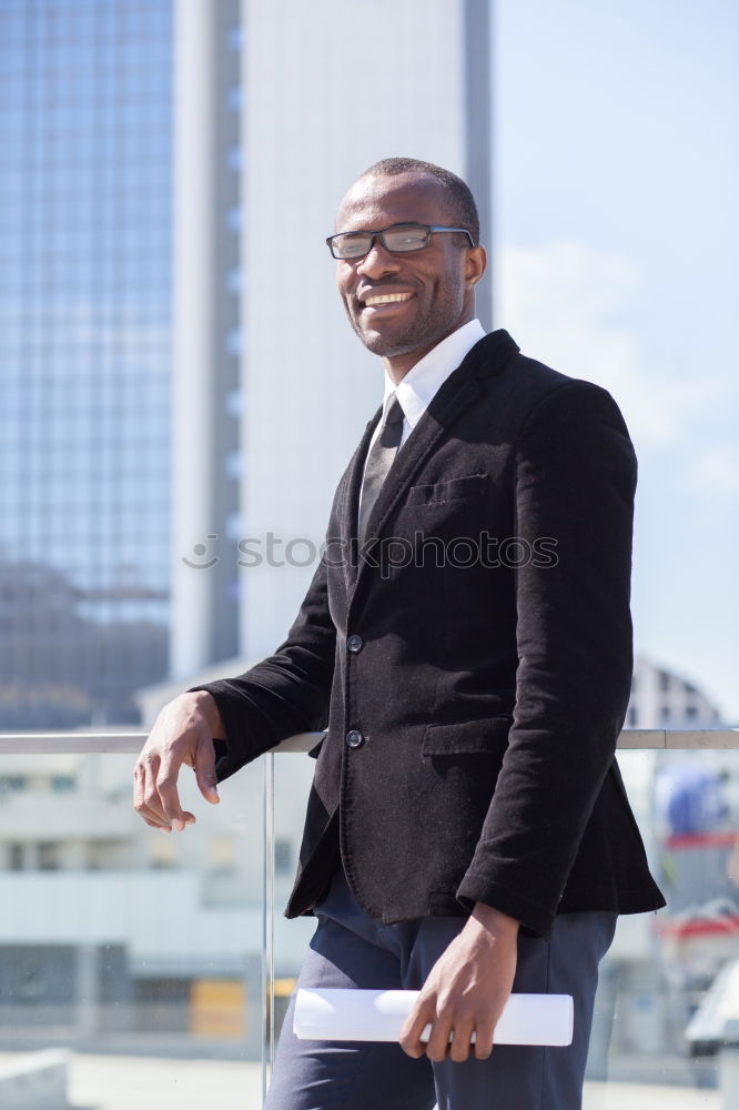 Similar – Handsome black man wearing suit in urban background