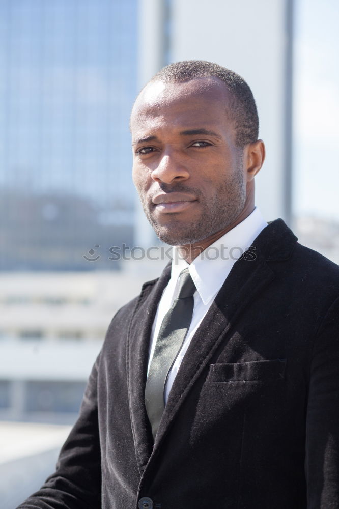 Similar – Handsome black man wearing suit in urban background