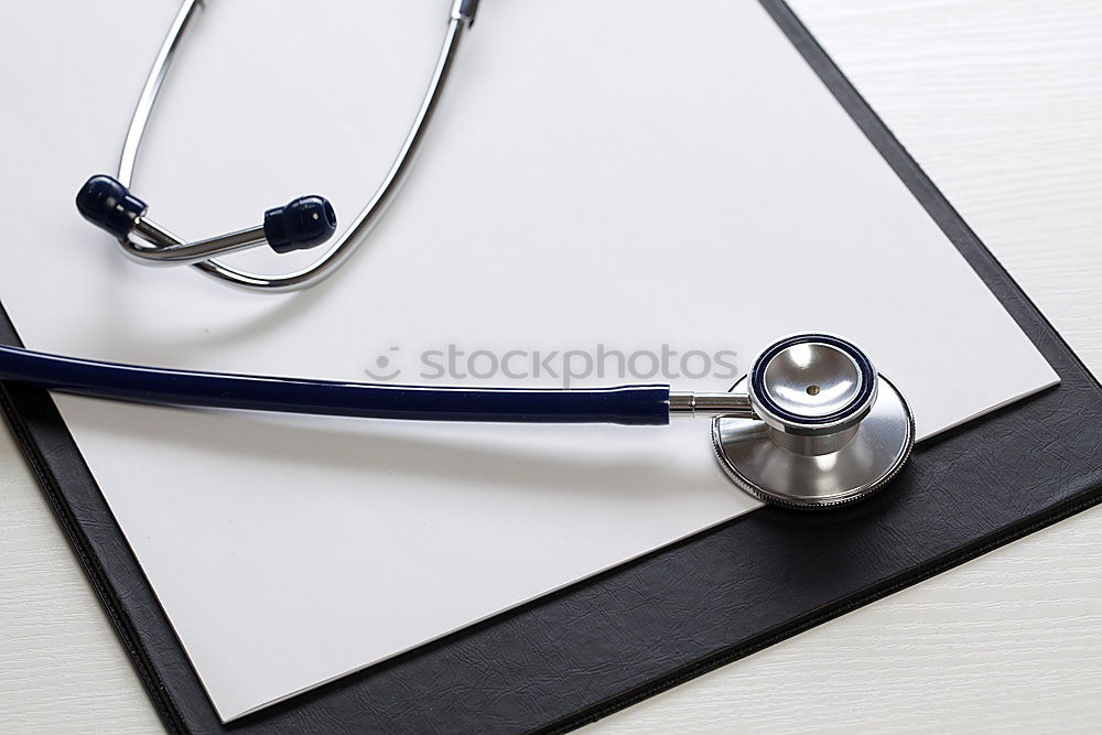Image, Stock Photo red stethoscope and empty clipboard on green