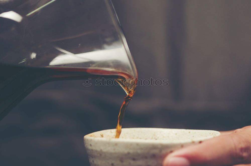 Similar – Image, Stock Photo Hand drip coffee, pouring water on coffee ground with filter drip style