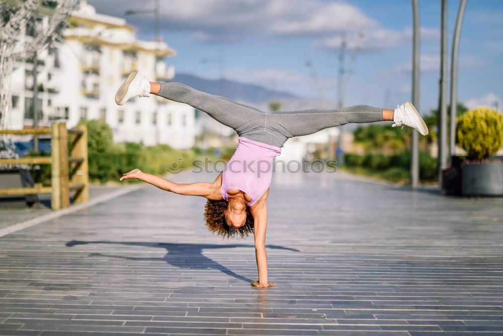 Similar – Black fit woman doing fitness acrobatics