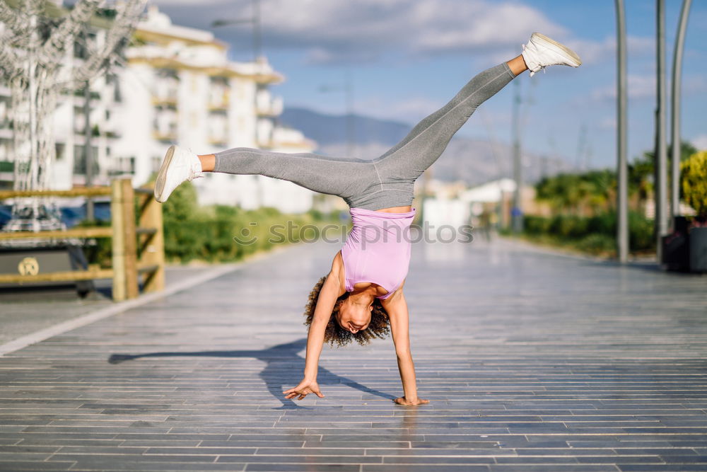 Similar – Image, Stock Photo Young caucasian woman doing yoga on road in sunset