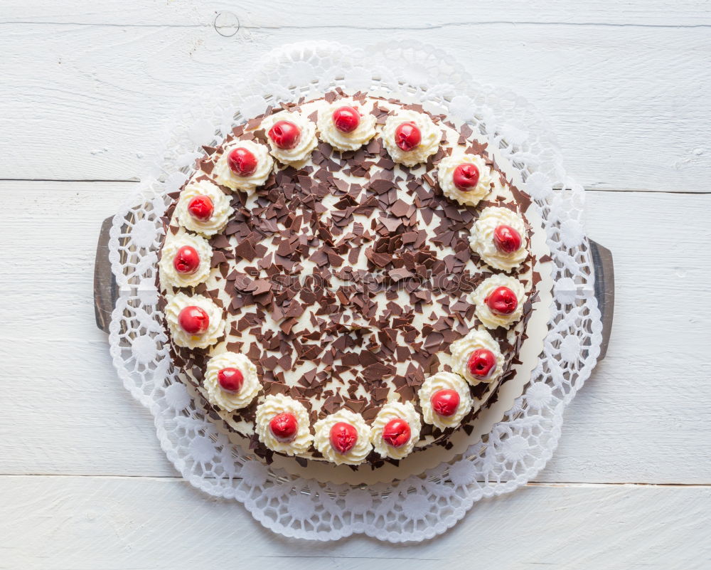 Similar – Image, Stock Photo Chocolate cream cake on blue wood with cake lace