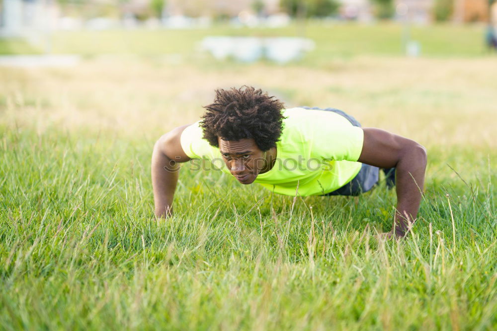 Similar – Image, Stock Photo Fit shirtless young black man doing legs stretching