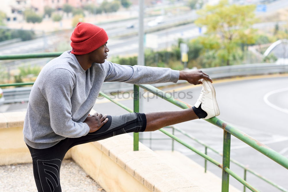 Similar – Image, Stock Photo Black man doing stretching after running outdoors