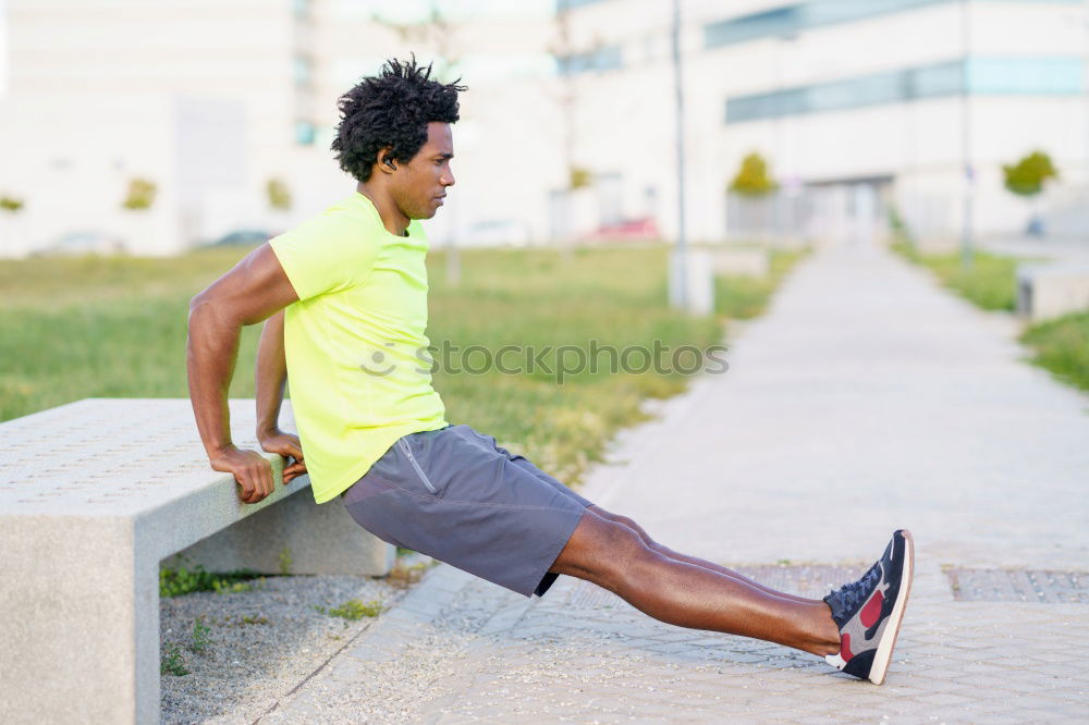 Similar – Black man doing stretching after running in urban background