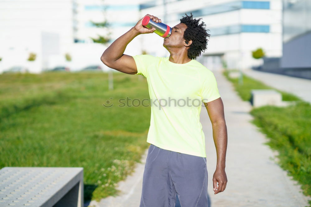 Similar – Image, Stock Photo Fit shirtless young black man drinking water after running