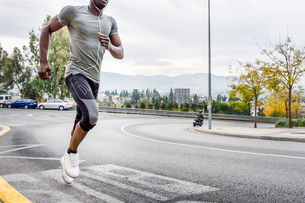 Similar – Black man running outdoors in urban road