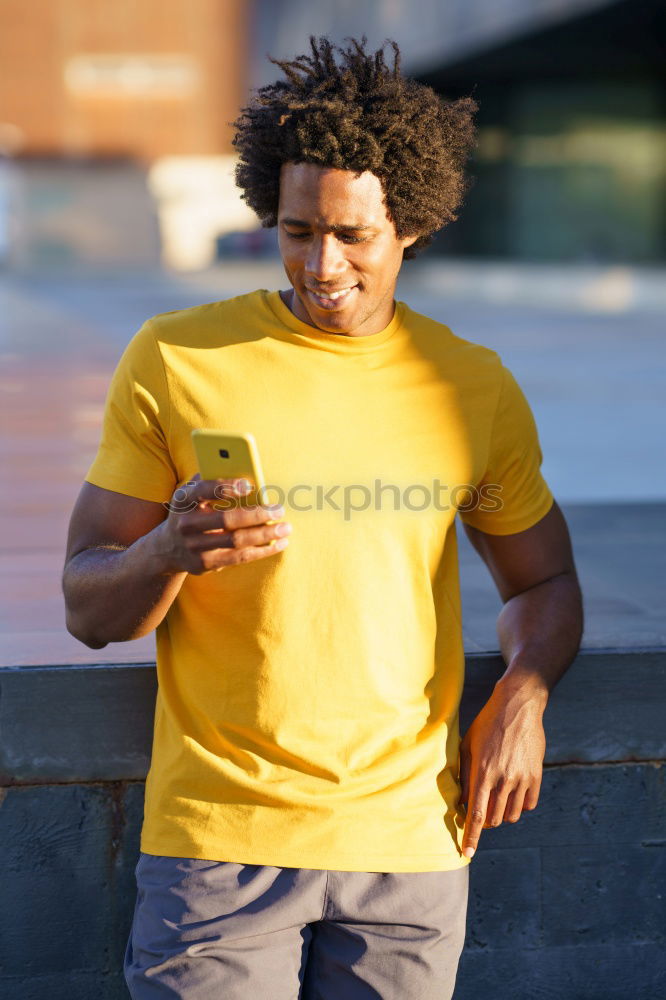 Similar – Image, Stock Photo Young black man eating an apple walking down the street.