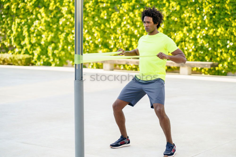 Similar – Black man running and listening to music in urban background